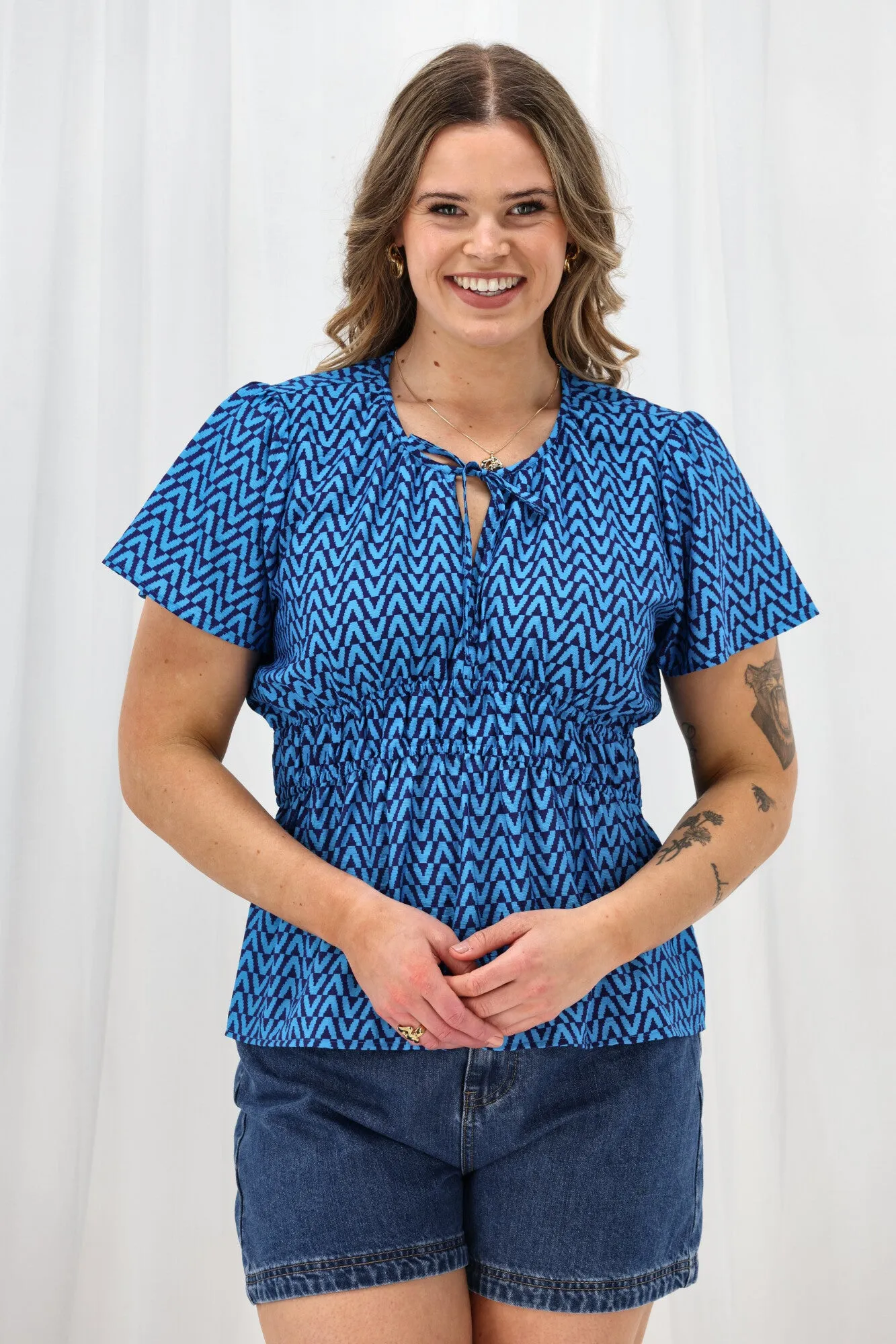 LightweightLayeredFabric ElasticTrimming Shine On Label Maddison Empire Waist Blouse Blue Geo